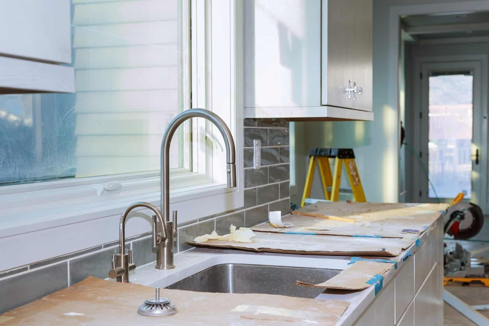 New kitchen renovation with modern cabinetry and a large window for natural light.